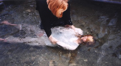 Baptism at Elisha's spring - Jericho.     Picture by Jane Denbo