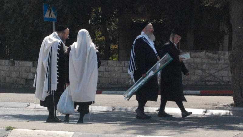 Hassidic Jews returning from prayer during Sukkot - near Mea Shearim