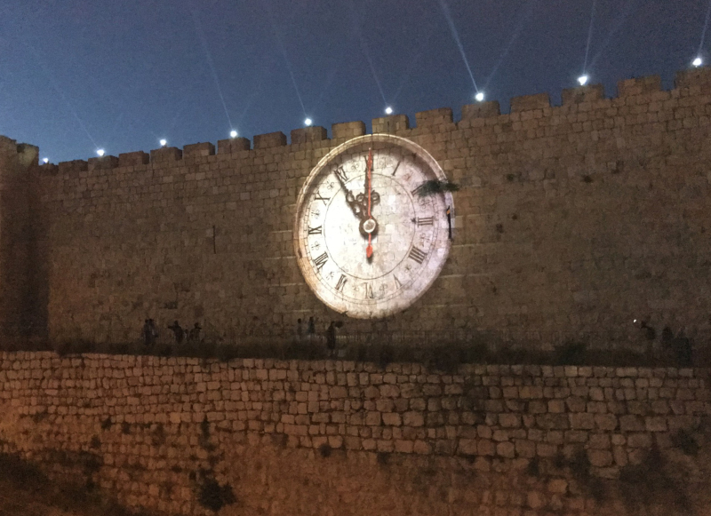 The prophetic clock, projected on the walls of Jerusalem.  Showing i's nearly midnight.