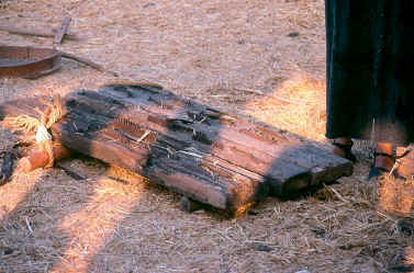 underside of threshing sled  -  showing iron teeth